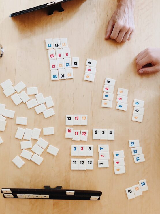 Engaging moments over a game, with friends enjoying coffee and connection at a welcoming table.