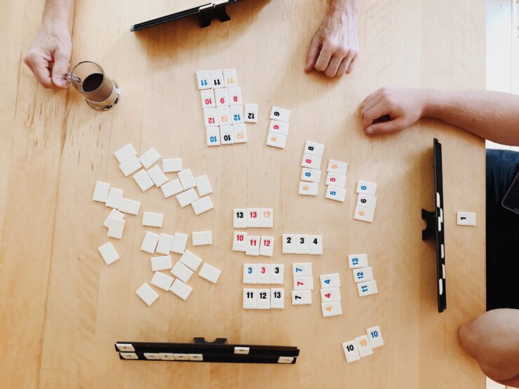 Engaging moments over a game, with friends enjoying coffee and connection at a welcoming table.