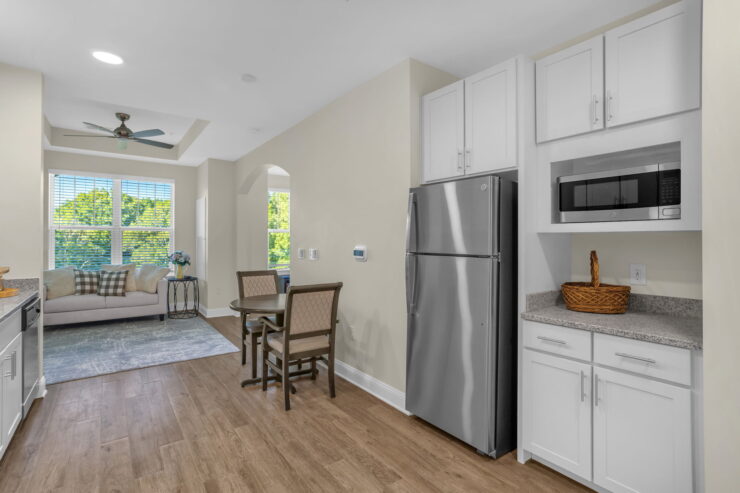 Bright and inviting kitchen area with comfortable seating, perfect for community gatherings.