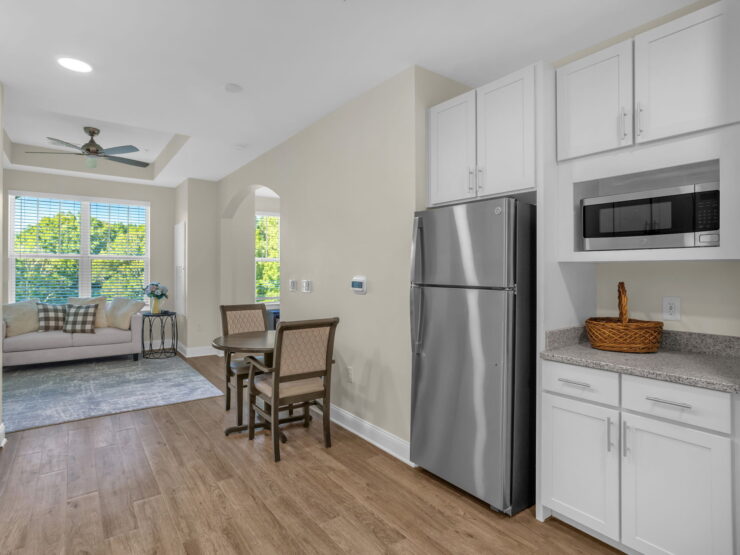 Bright and inviting kitchen area with comfortable seating, perfect for community gatherings.
