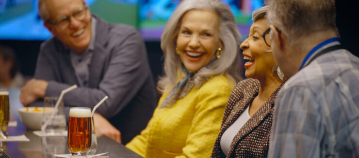 Laughter and camaraderie fill the vibrant gathering, showcasing joyful connections among friends.