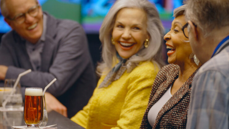 Laughter and camaraderie fill the vibrant gathering, showcasing joyful connections among friends.