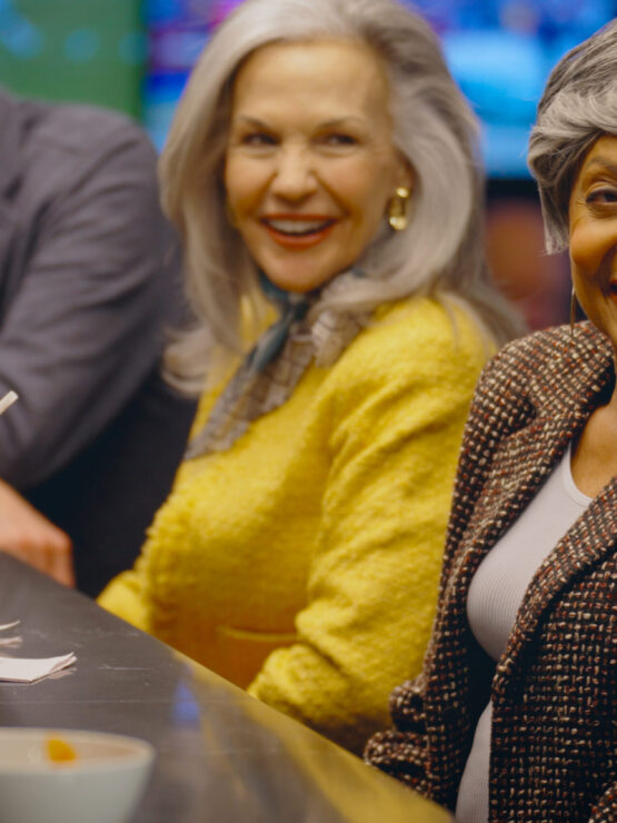 Lively conversation and laughter fill the bar, showcasing a vibrant community enjoying each other's company.