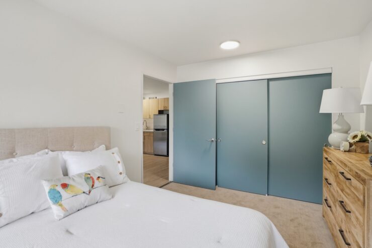 Bright and inviting, the serene bedroom offers comfort and a sense of community.