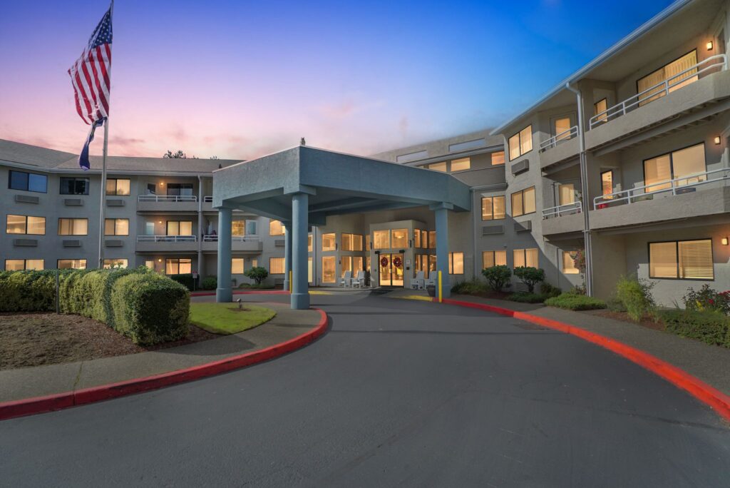 Welcoming entrance with vibrant greenery, inviting spaces, and a sense of community warmth.