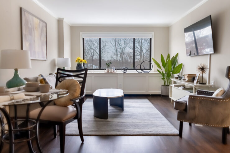 Bright and inviting, this serene living space fosters community and comfort with modern decor.