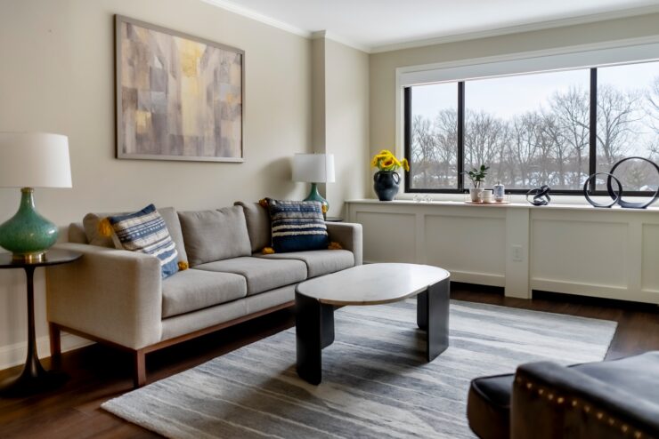 A welcoming lounge, featuring comfortable seating, vibrant decor, and natural light, perfect for community gatherings.