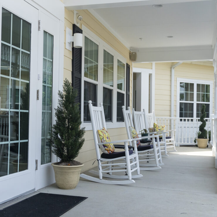 Welcoming porch with rocking chairs, inviting a sense of community and relaxation.