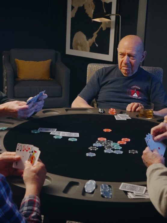 A warm gathering of friends enjoying a lively card game, fostering connection and camaraderie.