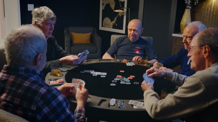 A warm gathering of friends enjoying a lively card game, fostering connection and camaraderie.