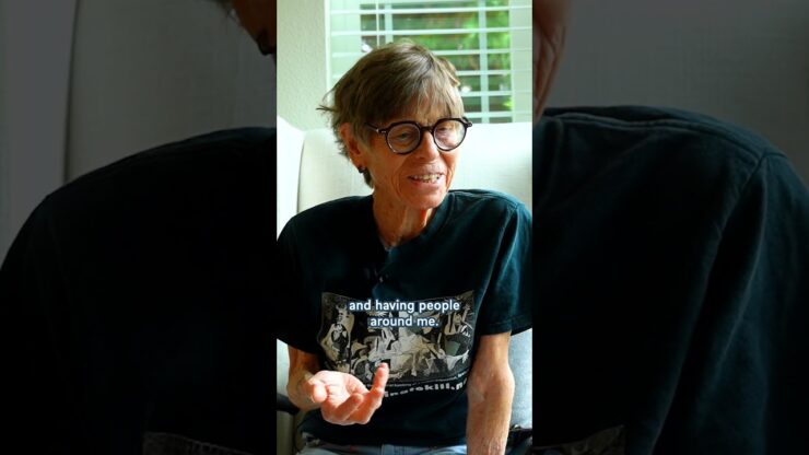 A warm conversation unfolds in a bright, inviting space, highlighting the joy of community and connection.