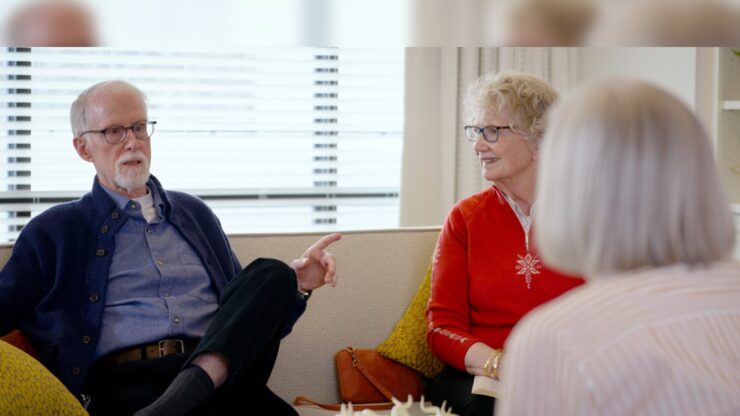 Engaging conversation among friends in a bright, inviting lounge fosters a sense of community.