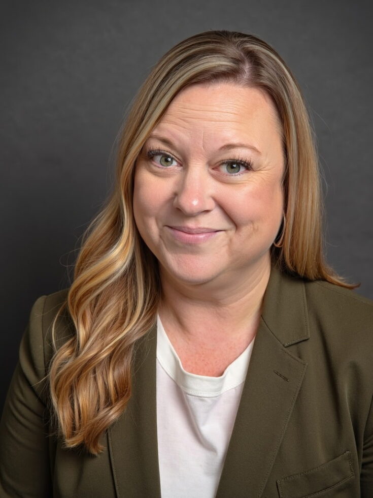 A warm smile reflects compassion and dedication, embodying a welcoming community spirit.