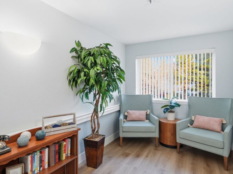 Bright and inviting, this serene corner offers comfortable seating and a warm atmosphere for community gatherings.