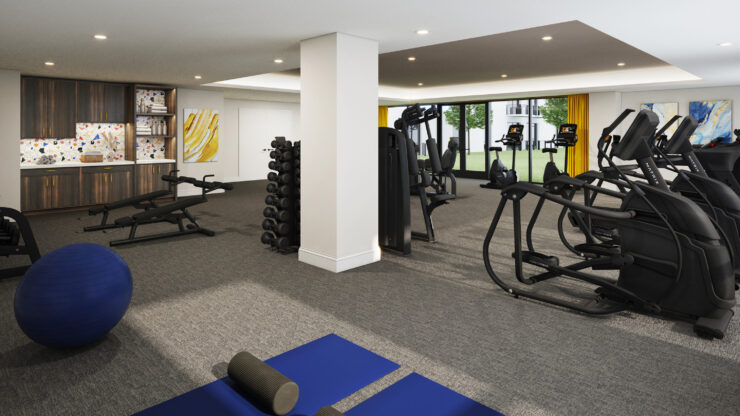 A bright fitness area filled with modern equipment, inviting wellness and community engagement.
