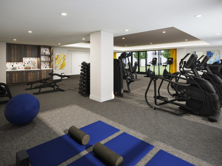 A bright fitness area filled with modern equipment, inviting wellness and community engagement.
