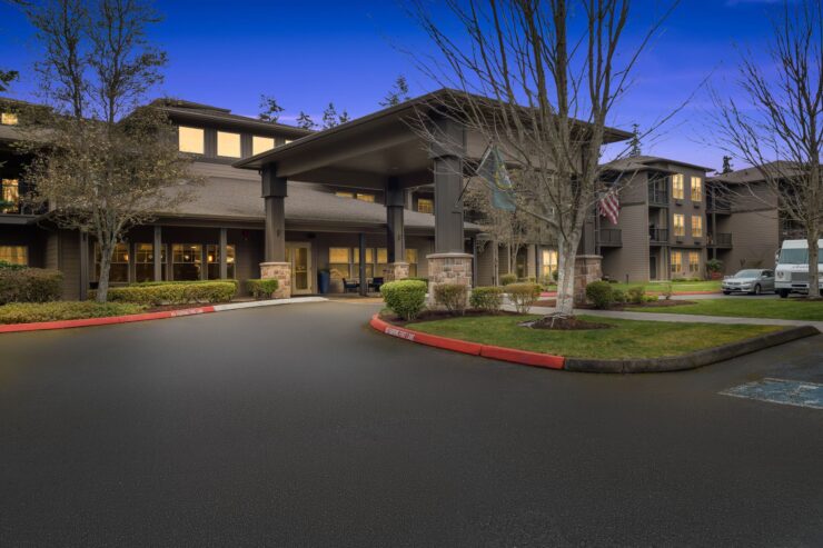 A welcoming entrance surrounded by greenery, reflecting a vibrant community atmosphere and comfort.