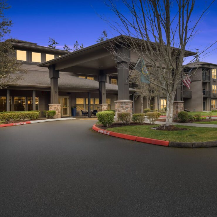 A welcoming entrance surrounded by greenery, reflecting a vibrant community atmosphere and comfort.