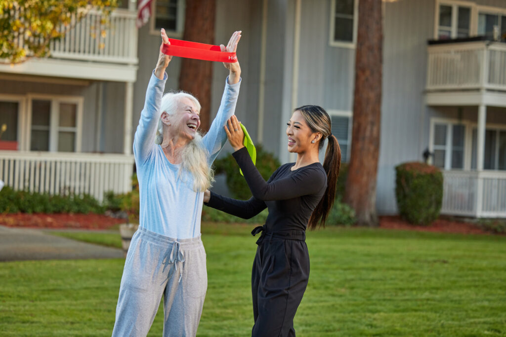 Laughter and joy fill the air as residents engage in uplifting activities in a welcoming garden.