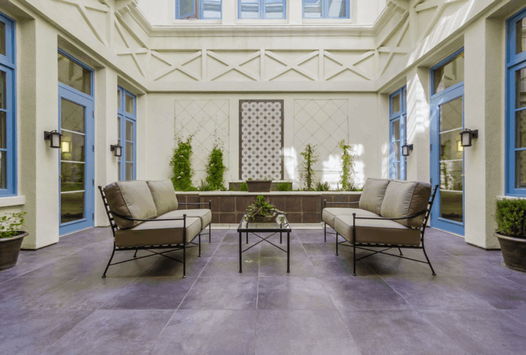 An inviting courtyard with comfortable seating and greenery, perfect for community gatherings.