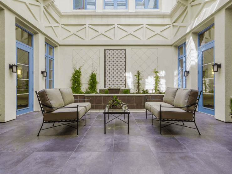 An inviting courtyard with comfortable seating and greenery, perfect for community gatherings.
