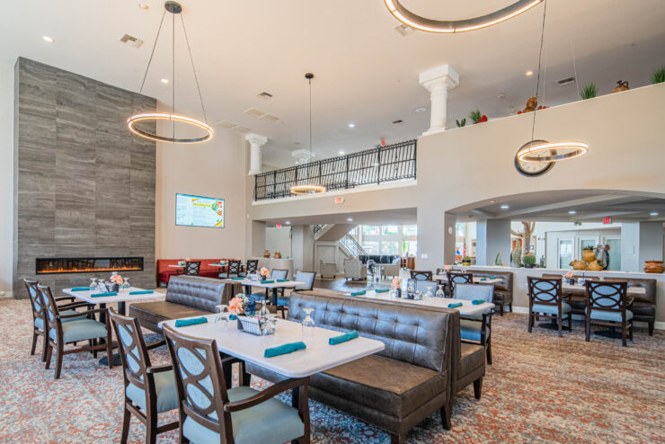 Bright and inviting dining area fosters community, featuring elegant decor and warm ambiance.