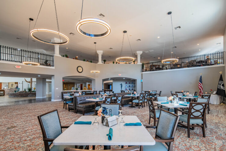 Bright, inviting dining space with elegant decor, fostering community and comfort for residents.