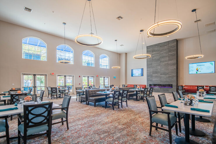 Bright, inviting dining area filled with comfortable seating, perfect for community gatherings and shared meals.