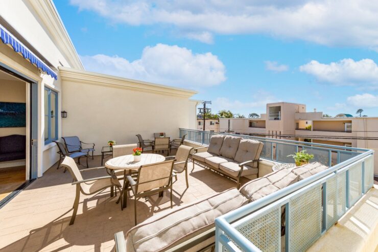 A bright, inviting terrace with comfortable seating invites relaxation and community gatherings.