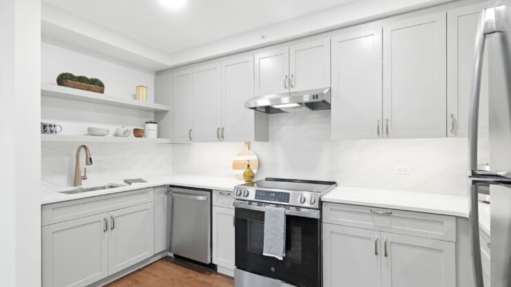 Bright, modern kitchen with ample storage and stainless steel appliances, inviting comfortable living.