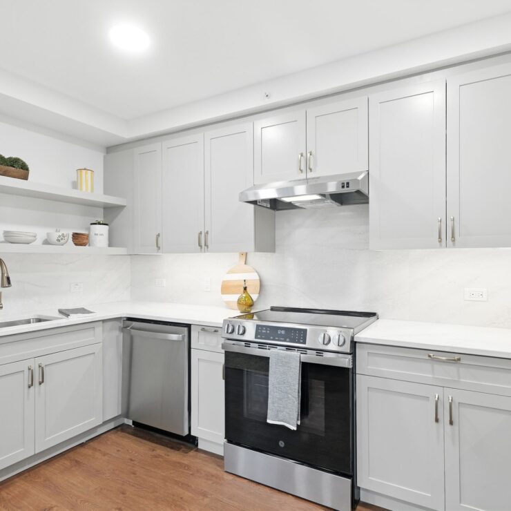 Bright, modern kitchen with ample storage and stainless steel appliances, inviting comfortable living.