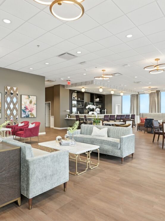 Bright and inviting lounge with comfortable seating, elegant decor, and communal dining areas.