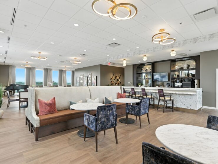 Bright, spacious dining area with comfortable seating and a welcoming social atmosphere.