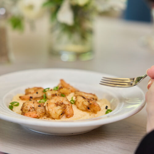 Delicious shrimp dish enjoyed in a warm dining setting that fosters community and comfort.