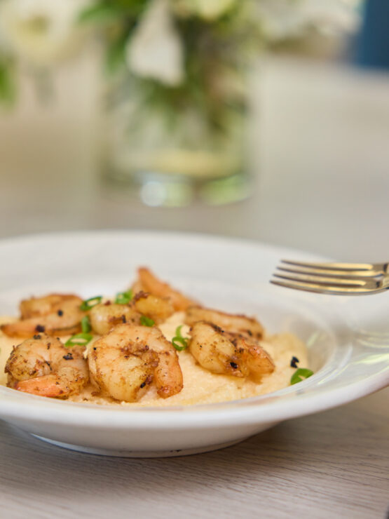Delicious shrimp dish enjoyed in a warm dining setting that fosters community and comfort.