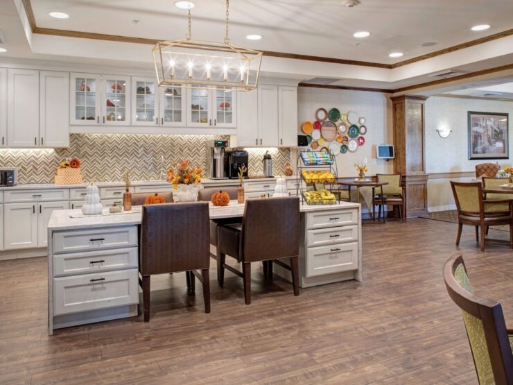 Bright, inviting bistro with comfortable seating and warm decor for residents to gather and relax.