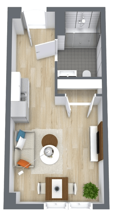Open living space with seating, dining area, kitchenette, and accessible bathroom for comfortable living.