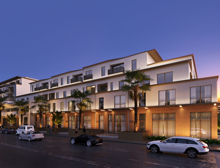 Modern retirement community building at dusk with residents enjoying a calm evening outdoors.