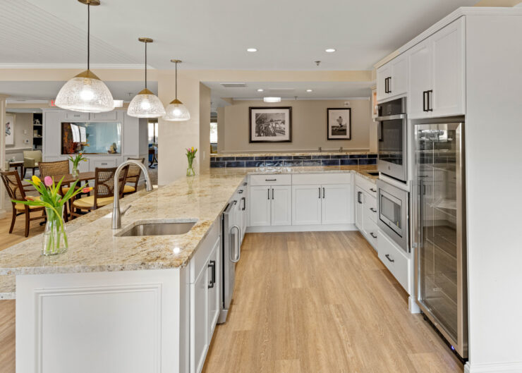 Bright and inviting kitchen with spacious countertops and seating for community gatherings.