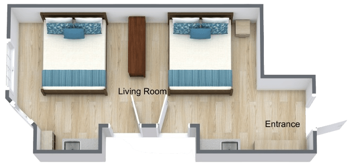 Bright companion suite with two comfortable beds, shared living area, and accessible design.