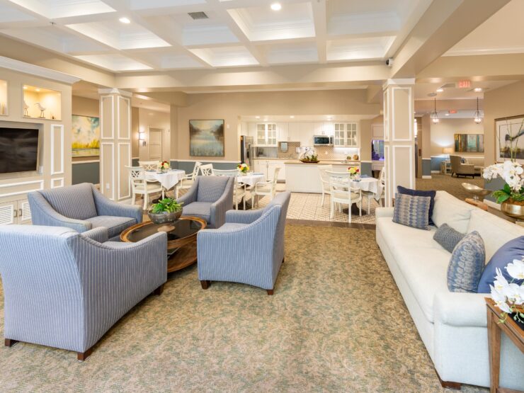Bright and inviting common area with comfortable seating, dining tables, and a welcoming atmosphere.