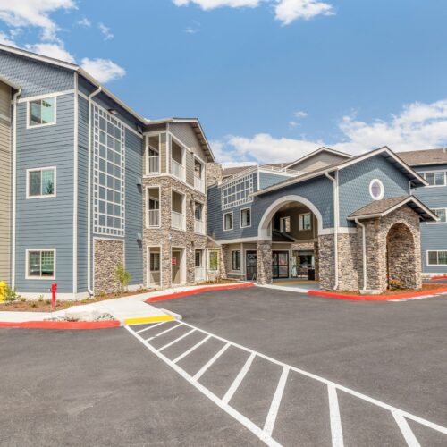 Modern, welcoming retirement community with inviting architecture and bright, open surroundings
