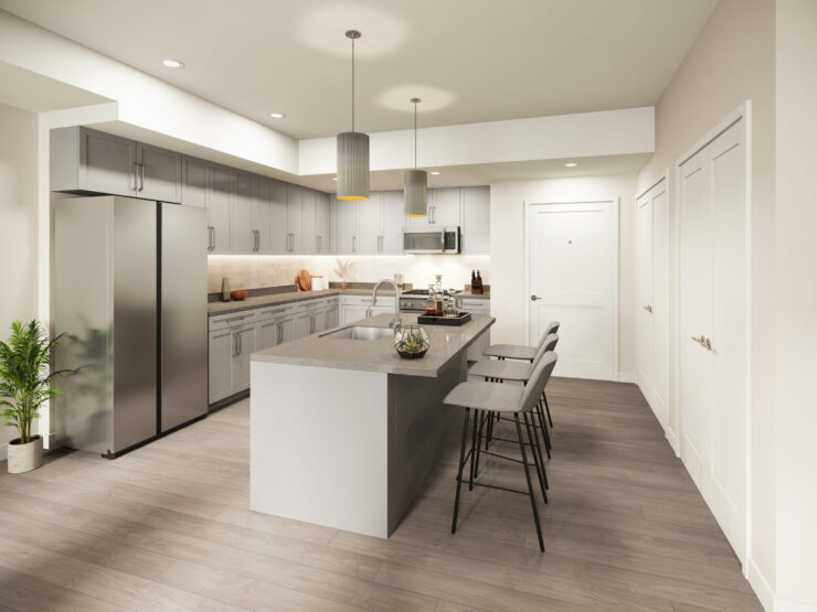 Spacious kitchen with modern amenities, an island with seating, and warm lighting for gatherings.