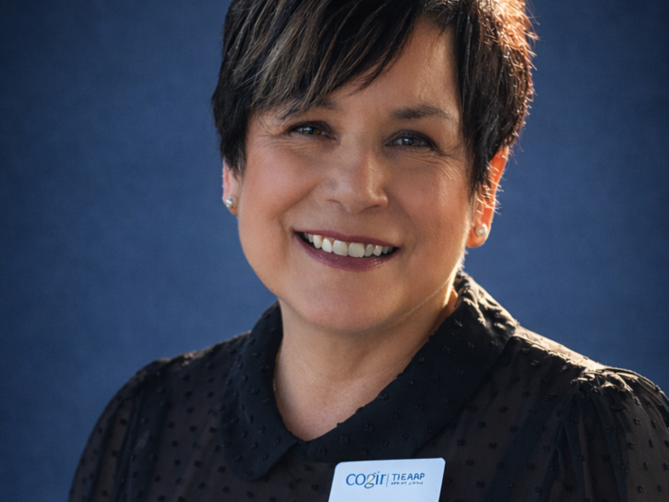 Friendly staff member smiling warmly, promoting a welcoming and supportive community.