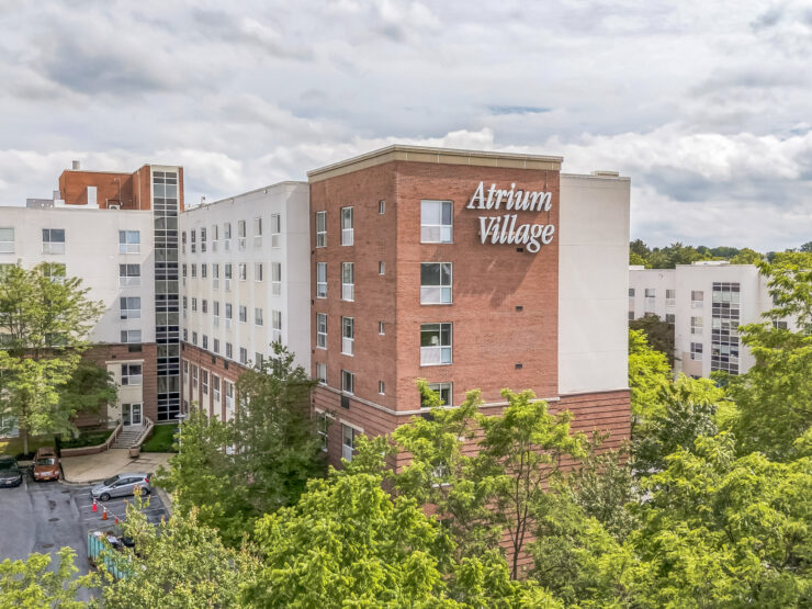 Atrium Village retirement home surrounded by trees, offering a peaceful community setting.