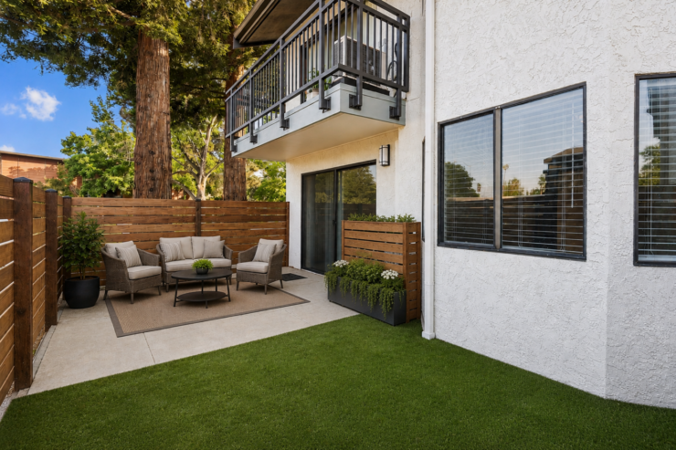 Outdoor patio with comfortable seating, greenery, and a welcoming, peaceful atmosphere.