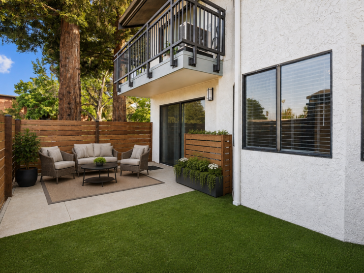 Outdoor patio with comfortable seating, greenery, and a welcoming, peaceful atmosphere.