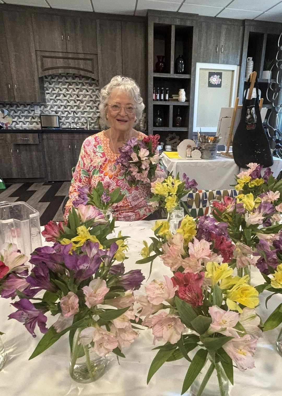 Pat S. arranges small bouquets for the dining room with bring color, fragrance, and life to the room. And all the diners really enjoy the fresh arrangements!