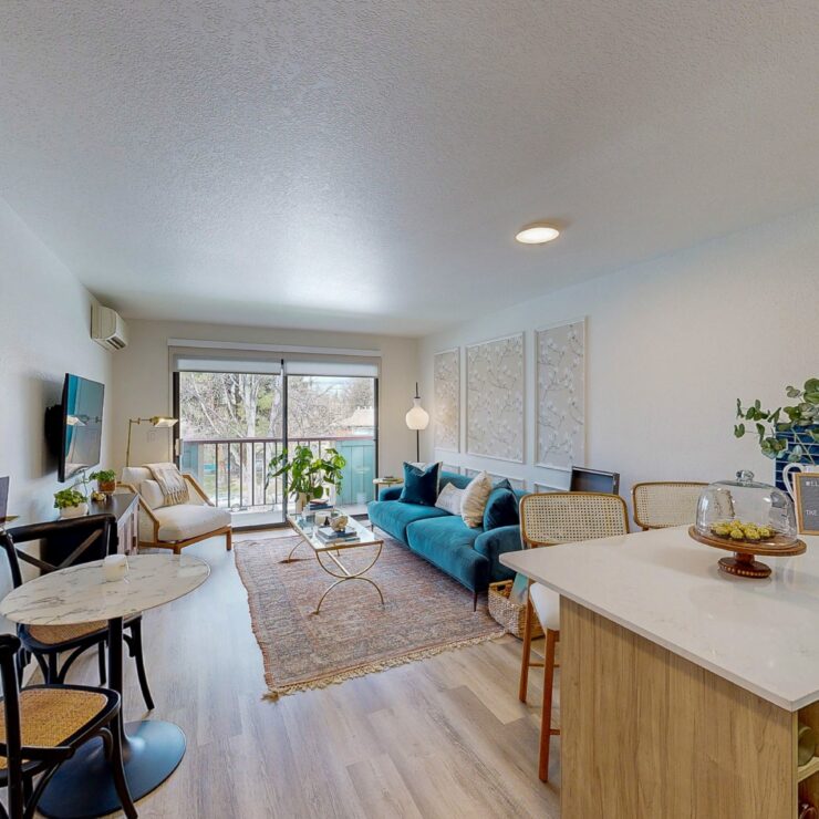 Bright and inviting living space with comfortable seating and natural light, perfect for socializing.
