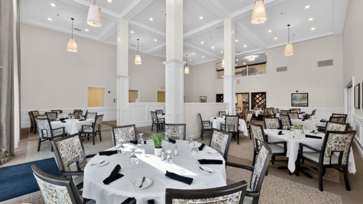 Bright, spacious dining area with elegant seating designed for communal comfort and connection.